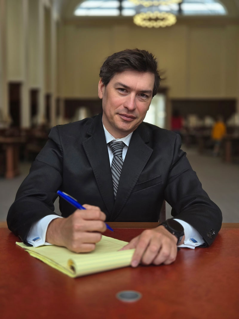 Personal Injury Attoney Kyle Peither taking notes on a legal pad